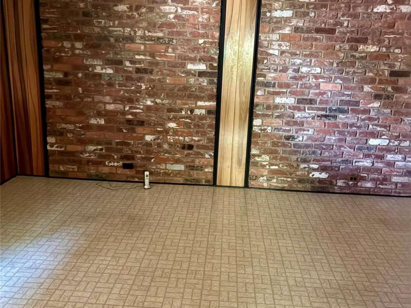 5806 Whitingham Drive, Charlotte, NC 28215.  MLS# CAR4263834, YatesRealty ID 27000. Flex room or office with view of brick on back wall. 