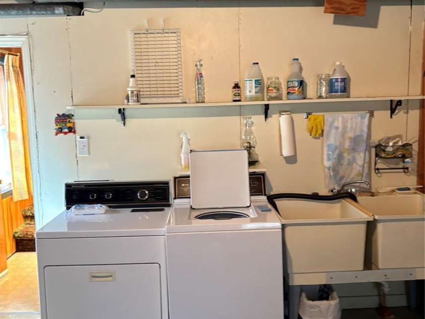 5806 Whitingham Drive, Charlotte, NC 28215.  MLS# CAR4263834, YatesRealty ID 27000. Laundry area on lower level with double sinks. 