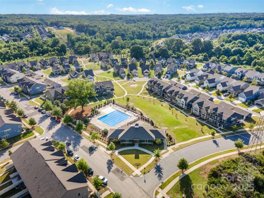 915 Claires Creek Lane, Davidson, NC 28036.  MLS# CAR4264930, YatesRealty ID 27003. Aerial view of community and pool