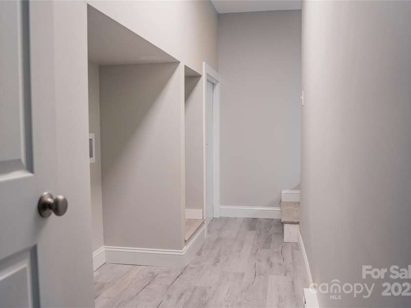 136 Day Drive, Boone, NC 28607.  MLS# CAR4270315, YatesRealty ID 27004. Lower-level hallway - washer & dryer hookups