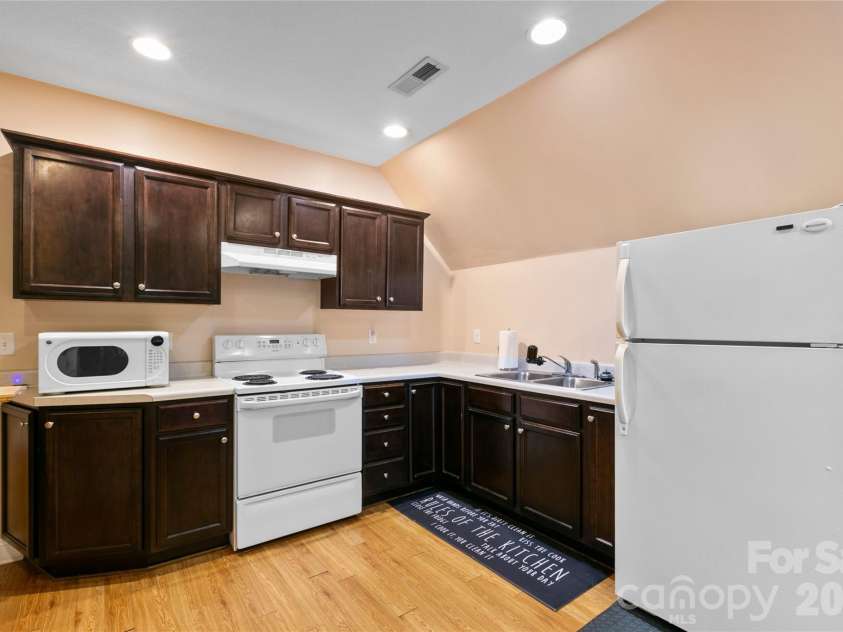 28 Chapel Park Road, Asheville, NC 28803.  MLS# CAR4359429, YatesRealty ID 27007. Upper floor kitchen