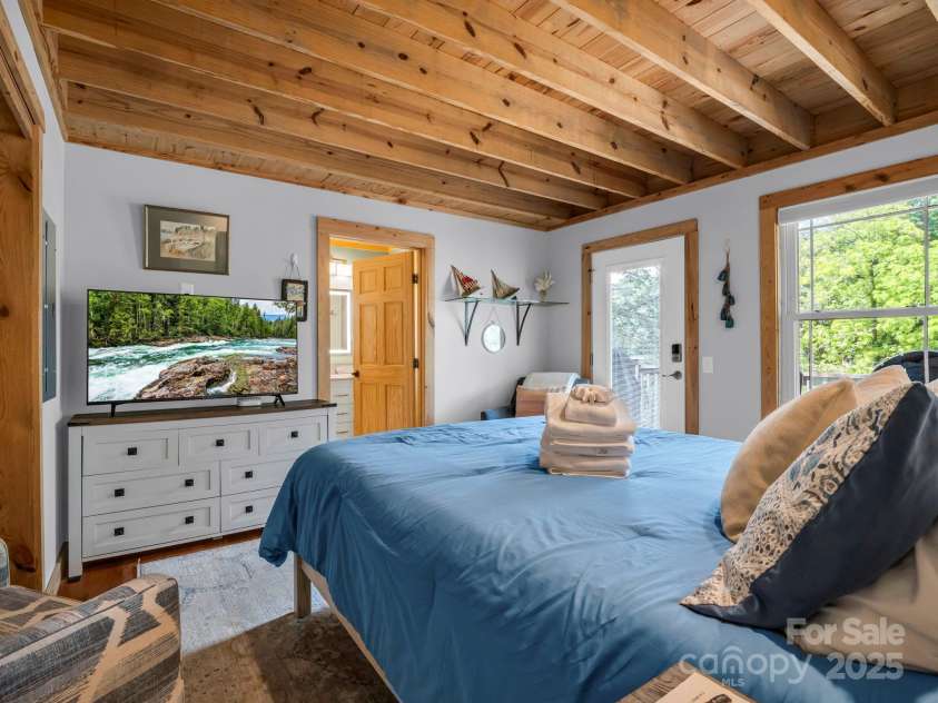 417 Tryon Bay Circle, Lake Lure, NC 28746.  MLS# CAR4279268, YatesRealty ID 27007. Bedroom with en-suite