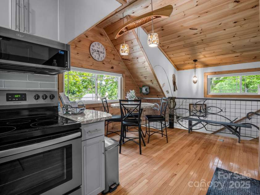 417 Tryon Bay Circle, Lake Lure, NC 28746.  MLS# CAR4279268, YatesRealty ID 27007. Kitchen views of Dining