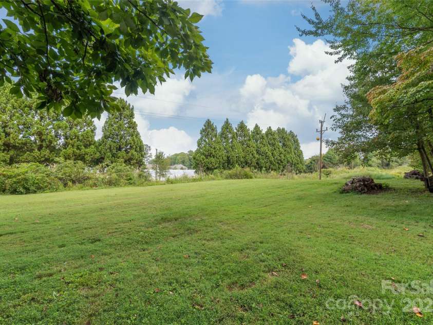 310 Oakwood Drive, Mount Holly, NC 28120.  MLS# CAR4297831, YatesRealty ID 2701. Back yard