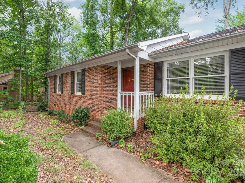 310 Oakwood Drive, Mount Holly, NC 28120.  MLS# CAR4297831, YatesRealty ID 2701. Front sidewalk