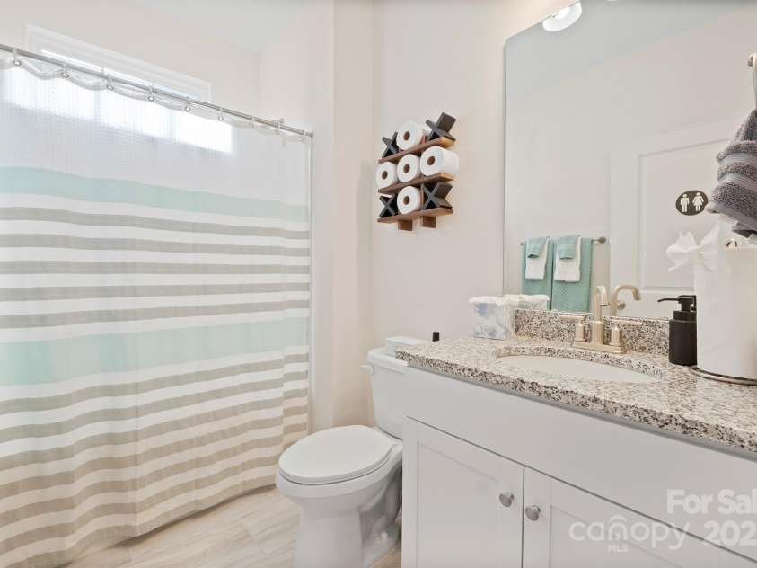 758 Latrobe Drive, Iron Station, NC 28080.  MLS# CAR4237714, YatesRealty ID 27013. Guest bathroom