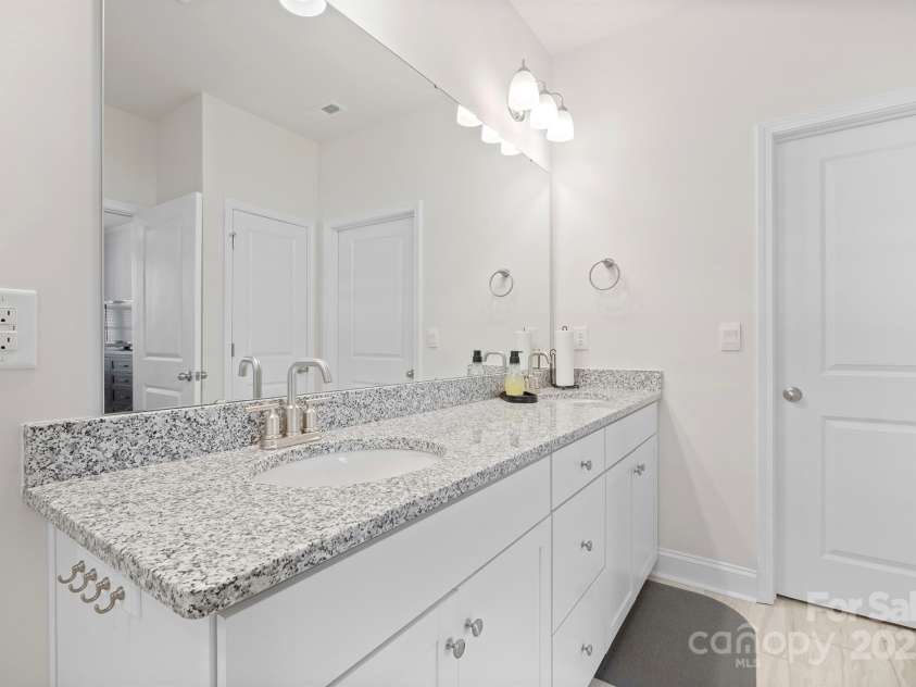 758 Latrobe Drive, Iron Station, NC 28080.  MLS# CAR4237714, YatesRealty ID 27013. Primary bathroom