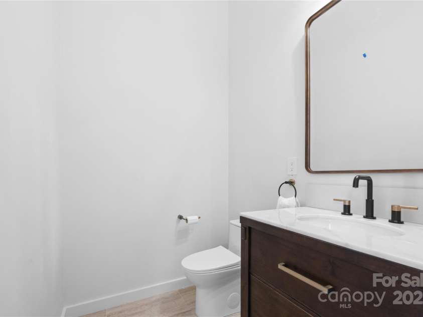 1075 Center Court Drive, Boone, NC 28605.  MLS# CAR4313256, YatesRealty ID 2702. Half bath off foyer