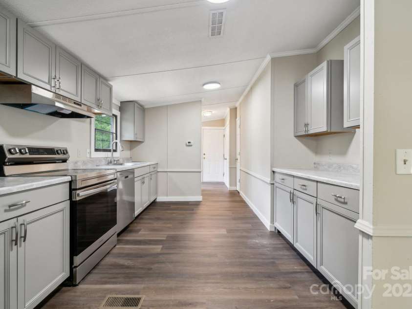 5001 Grand Canyon Road, Concord, NC 28027.  MLS# CAR4256169, YatesRealty ID 27021. Brand New Kitchen with new Cabinets/Drawers, Countertops, & Stainless Steel Appliances