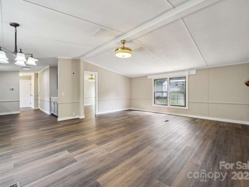 5001 Grand Canyon Road, Concord, NC 28027.  MLS# CAR4256169, YatesRealty ID 27021. Open Floorplan of Living Room leading into the Kitchen