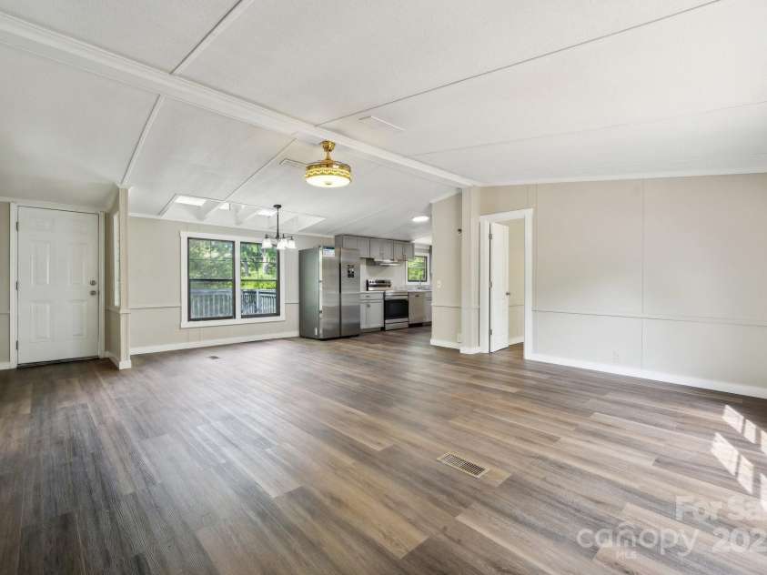 5001 Grand Canyon Road, Concord, NC 28027.  MLS# CAR4256169, YatesRealty ID 27021. Open Floorplan of Living Room leading into the Kitchen