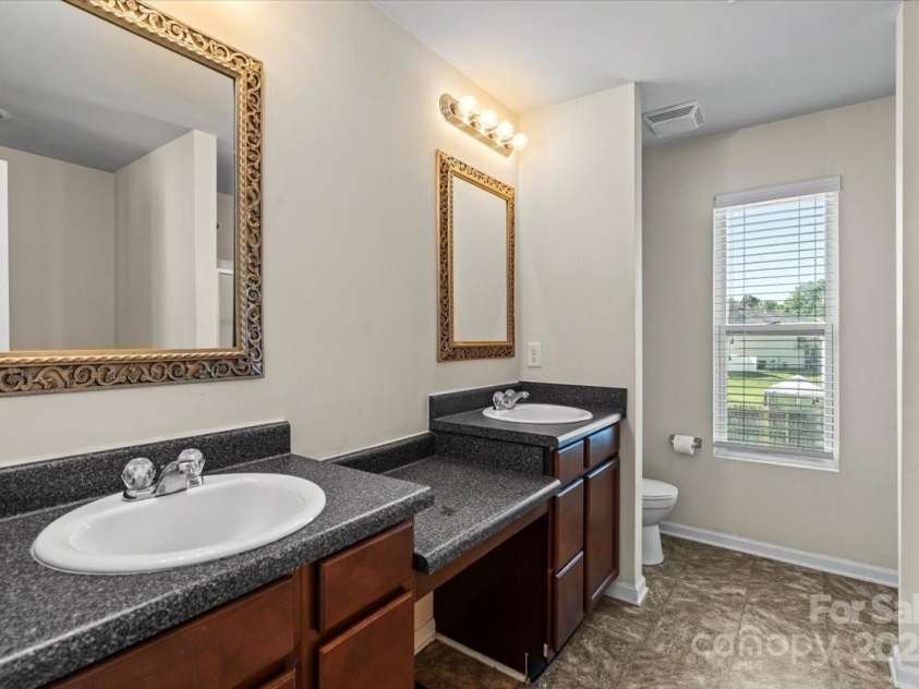 7136 Bullock Drive, Charlotte, NC 28214.  MLS# CAR4272820, YatesRealty ID 27025. Dual Vanities