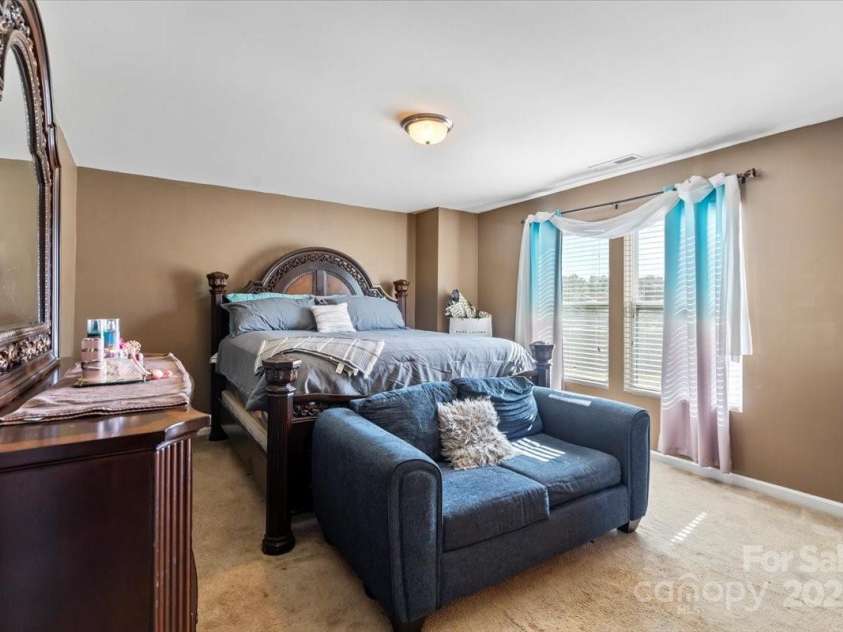 7136 Bullock Drive, Charlotte, NC 28214.  MLS# CAR4272820, YatesRealty ID 27025. Spacious Primary Bedroom