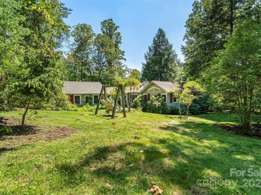17 Park Road, Asheville, NC 28803.  MLS# CAR4278105, YatesRealty ID 27028. Back yard with swing that conveys