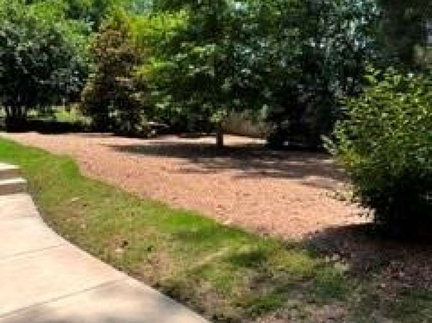 566 West End Drive, Charlotte, NC 28208.  MLS# CAR4359190, YatesRealty ID 27030. Fresh landscaping completed with new mulch and new grass growing