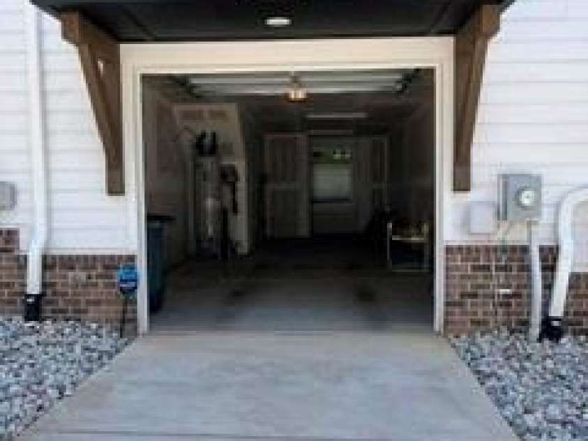 566 West End Drive, Charlotte, NC 28208.  MLS# CAR4359190, YatesRealty ID 27030. Newly painted exterior and landscaping rocks