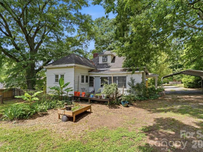 1815 Hemlock Avenue, Gastonia, NC 28054.  MLS# CAR4383647, YatesRealty ID 27033. Backyard, Garden, Deck, and Carport View