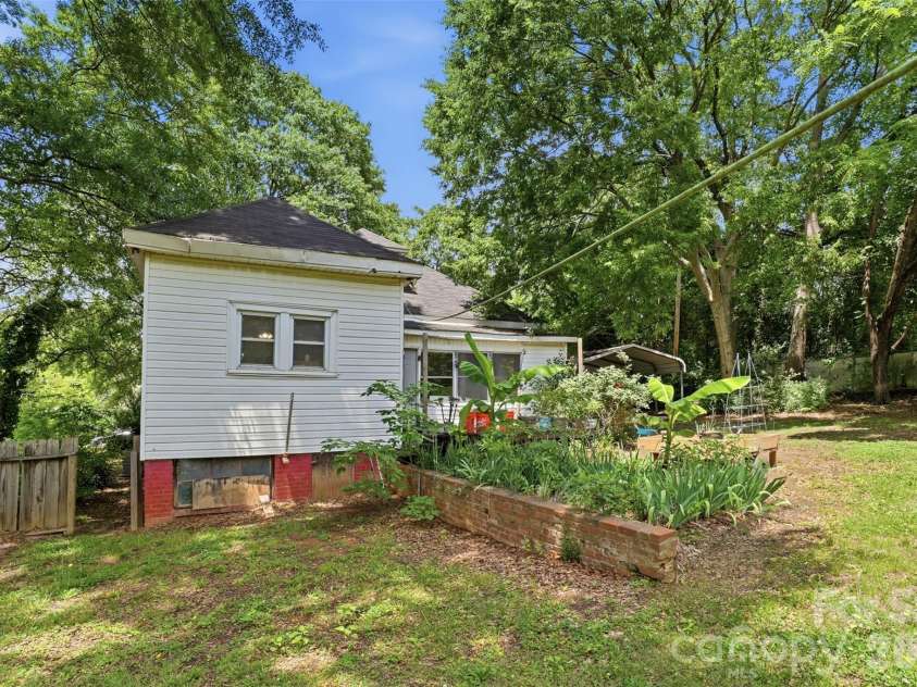1815 Hemlock Avenue, Gastonia, NC 28054.  MLS# CAR4383647, YatesRealty ID 27033. Backyard w/Crawlspace Entry #1