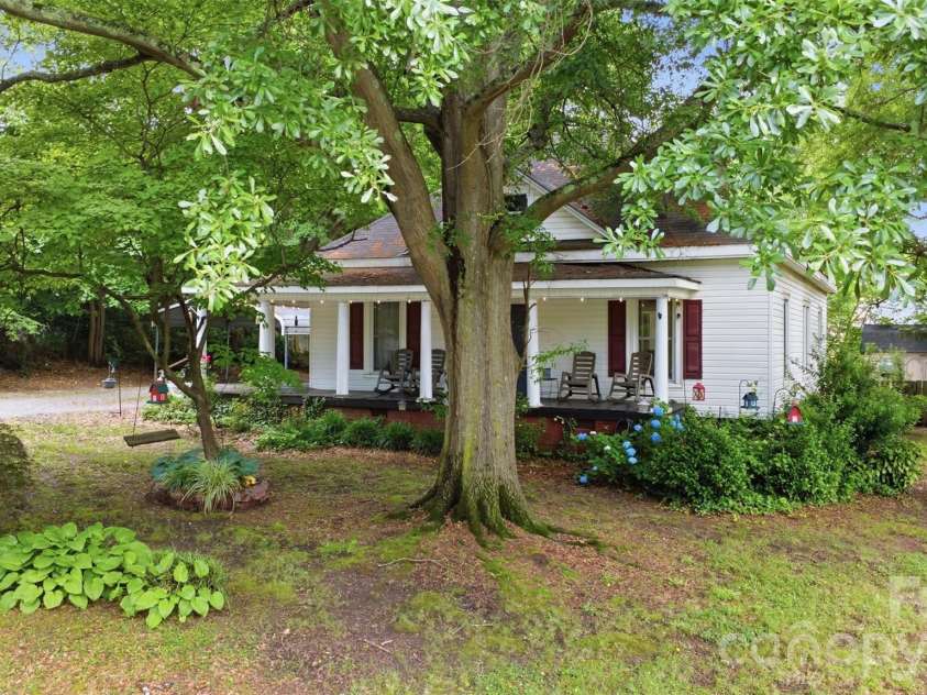 1815 Hemlock Avenue, Gastonia, NC 28054.  MLS# CAR4383647, YatesRealty ID 27033. Front Yard View and Tree w/ Swing