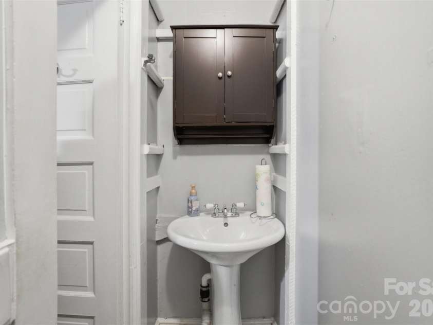 1815 Hemlock Avenue, Gastonia, NC 28054.  MLS# CAR4383647, YatesRealty ID 27033. Half Bath in 2nd Bedroom on Main Floor