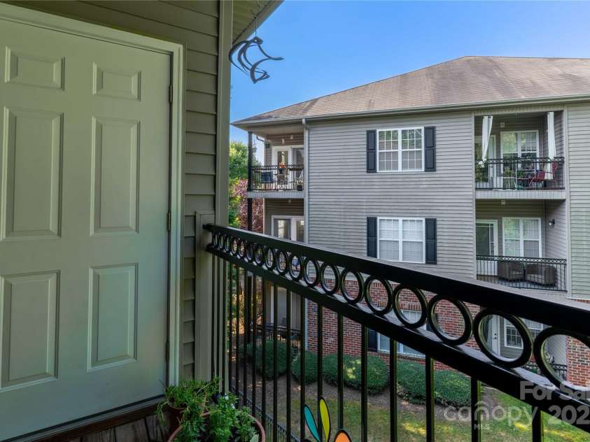 332 Appeldoorn Circle, Asheville, NC 28803.  MLS# CAR4279509, YatesRealty ID 27033. Balcony and storage access door