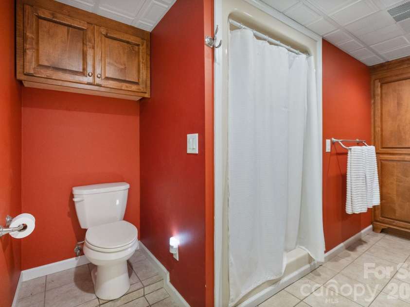 24756 Strand Drive, Albemarle, NC 28001.  MLS# CAR4367629, YatesRealty ID 27039. Main level primary suite bathroom