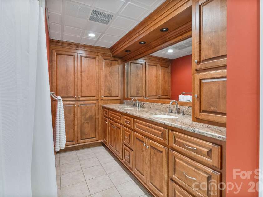 24756 Strand Drive, Albemarle, NC 28001.  MLS# CAR4367629, YatesRealty ID 27039. Main level primary suite bathroom