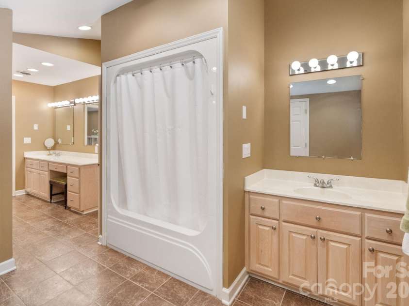 24756 Strand Drive, Albemarle, NC 28001.  MLS# CAR4367629, YatesRealty ID 27039. Upper level primary suite bathroom.