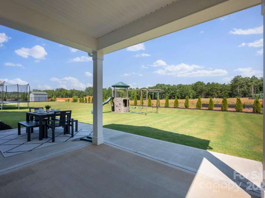 187 Tetcott Street, Mooresville, NC 28115.  MLS# CAR4278283, YatesRealty ID 27048. Overlooking the large yard