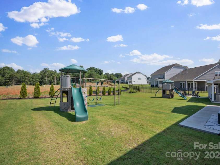187 Tetcott Street, Mooresville, NC 28115.  MLS# CAR4278283, YatesRealty ID 27048. Swingset included with Monkey Bars!