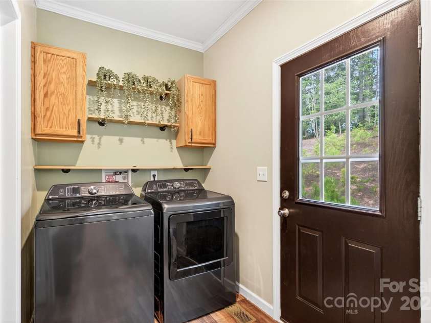 194 Love Drive, Marion, NC 28752.  MLS# CAR4280471, YatesRealty ID 27053. Laundry area leading to back door