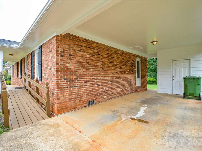 2500 Judith Avenue, Gastonia, NC 28054.  MLS# CAR4282124, YatesRealty ID 27057. Additional storage room in carport