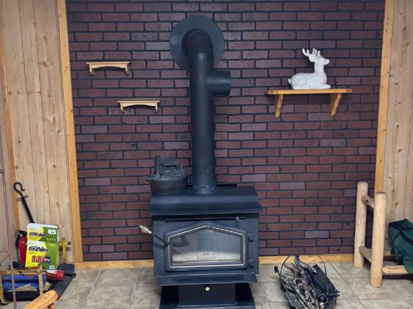 408 Dora Lane, Bakersville, NC 28705.  MLS# CAR4311694, YatesRealty ID 2706. Wood stove