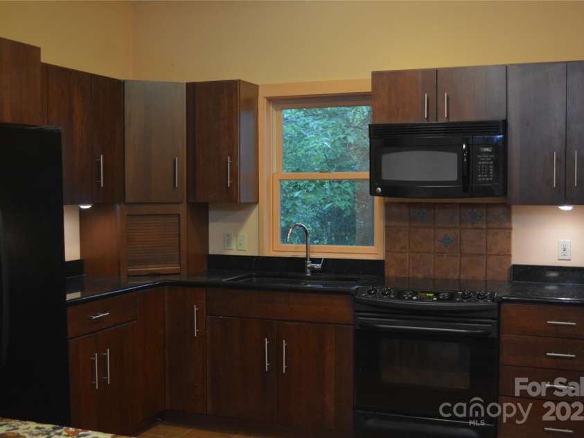 79 Connelly Road, Arden, NC 28704.  MLS# CAR4211499, YatesRealty ID 2706. 2nd living area apartment with full kitchen