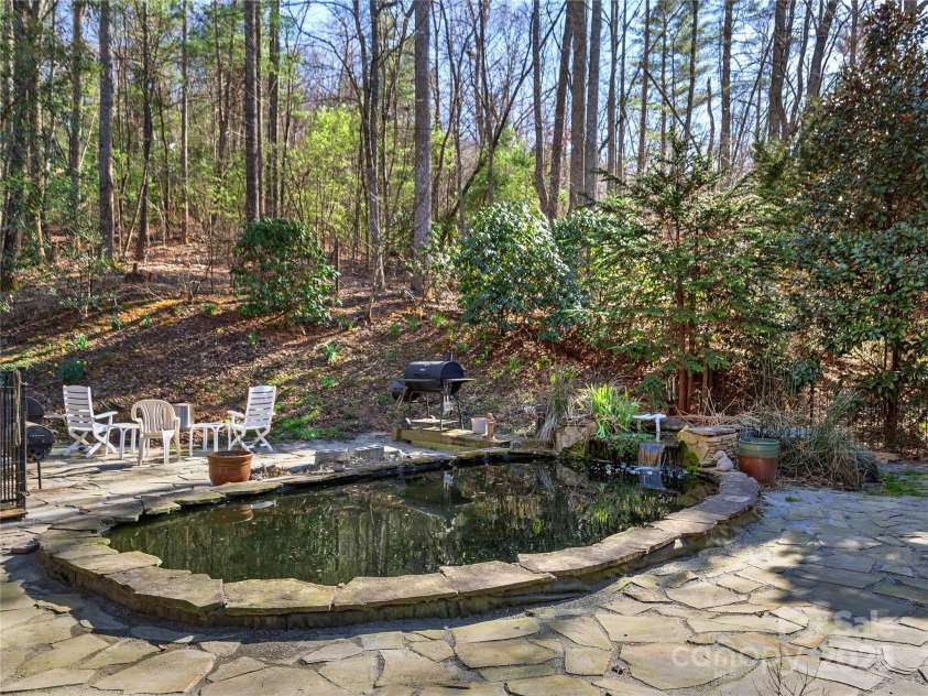 79 Connelly Road, Arden, NC 28704.  MLS# CAR4211499, YatesRealty ID 2706. Koi pond with waterfall