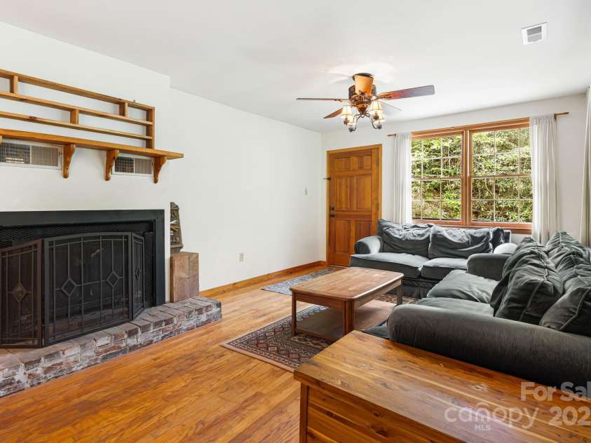 83 Snowy Cove Lane, Black Mountain, NC 28711.  MLS# CAR4255677, YatesRealty ID 27065. Wood burning fireplace