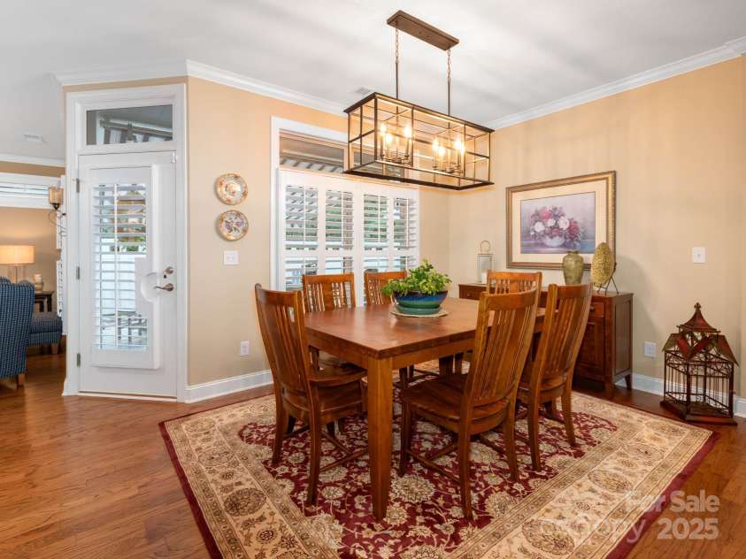 14914 Dewpoint Place, Huntersville, NC 28078.  MLS# CAR4279093, YatesRealty ID 27066. Dining room accommodates a large table for guests and leads out to the private courtyard.