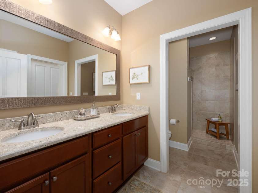 14914 Dewpoint Place, Huntersville, NC 28078.  MLS# CAR4279093, YatesRealty ID 27066. Double primary vanity with double sinks, quartz countertop.  Completely tiled, walk-in shower with no doors to clean!