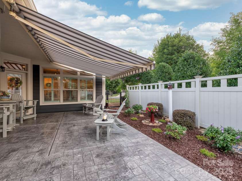 14914 Dewpoint Place, Huntersville, NC 28078.  MLS# CAR4279093, YatesRealty ID 27066. Enjoy the outdoors anytime with the awning that covers most of the patio.