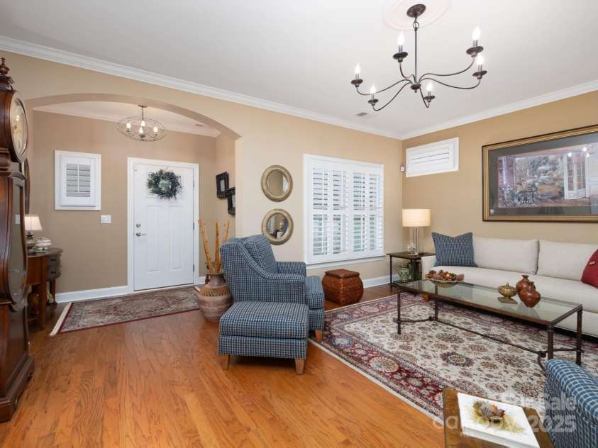 14914 Dewpoint Place, Huntersville, NC 28078.  MLS# CAR4279093, YatesRealty ID 27066. Entry foyer and living room with updated light fixtures and neutral paint.