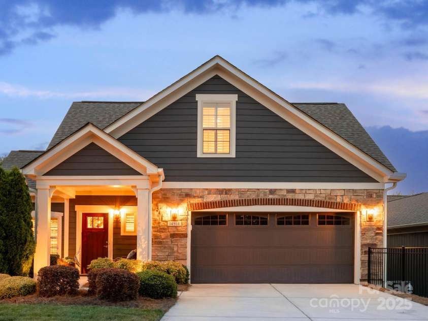 14914 Dewpoint Place, Huntersville, NC 28078.  MLS# CAR4279093, YatesRealty ID 27066. Handsome fiber cement exterior completely painted in 2023 with stone and brick accents.