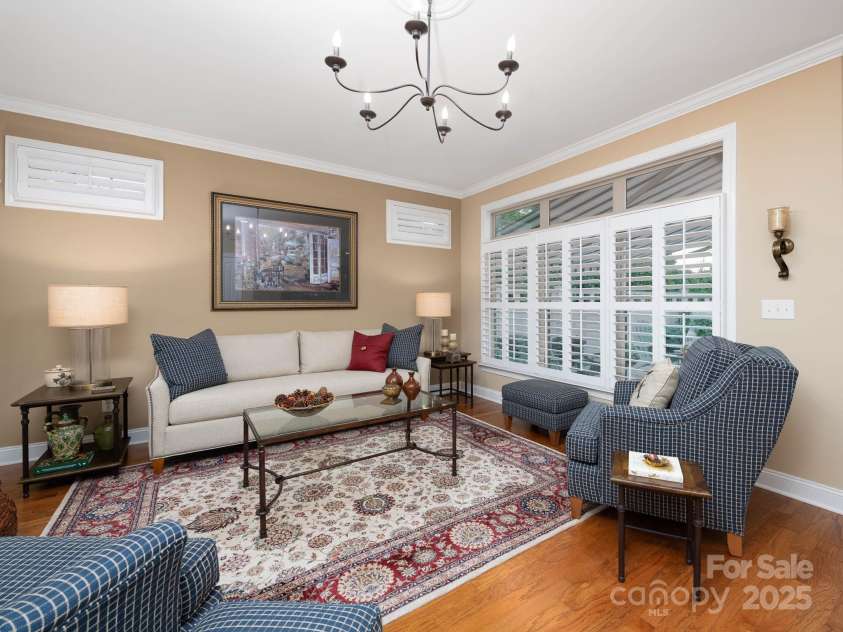 14914 Dewpoint Place, Huntersville, NC 28078.  MLS# CAR4279093, YatesRealty ID 27066. Living room looks out into the courtyard and is flooded with natural light.
