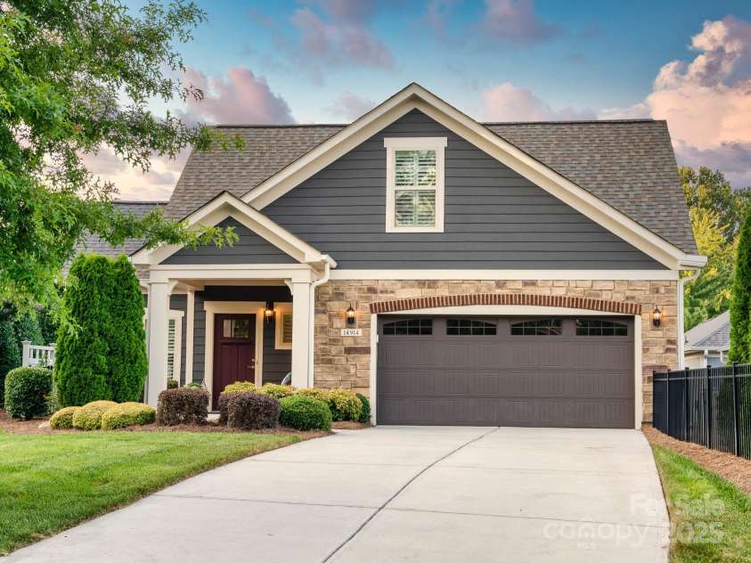 14914 Dewpoint Place, Huntersville, NC 28078.  MLS# CAR4279093, YatesRealty ID 27066. Private courtyard to the left is surrounded by mature landscaping so you are not facing another home from the courtyard.