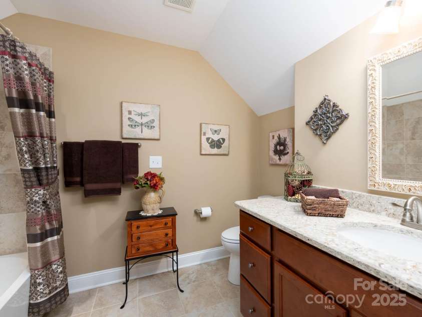 14914 Dewpoint Place, Huntersville, NC 28078.  MLS# CAR4279093, YatesRealty ID 27066. Upstairs full bath with tiled shower and vanity with quartz countertop.