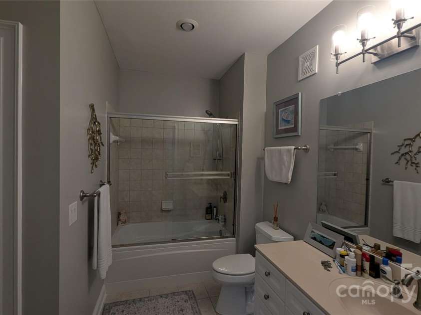 91 Glenview Lane, Maggie Valley, NC 28751.  MLS# CAR4312571, YatesRealty ID 2707. Guest bathroom with access from hall and guest bedroom suite