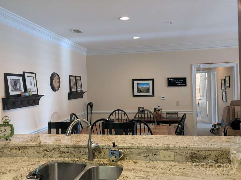 91 Glenview Lane, Maggie Valley, NC 28751.  MLS# CAR4312571, YatesRealty ID 2707. Kitchen into dining area over breakfast bar