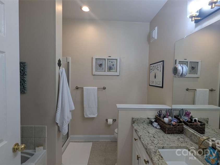 91 Glenview Lane, Maggie Valley, NC 28751.  MLS# CAR4312571, YatesRealty ID 2707. Primary Suite bath