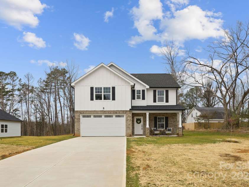 5319 Carden Drive, Charlotte, NC 28227.  MLS# CAR4196419, YatesRealty ID 27070. Dining room and living room