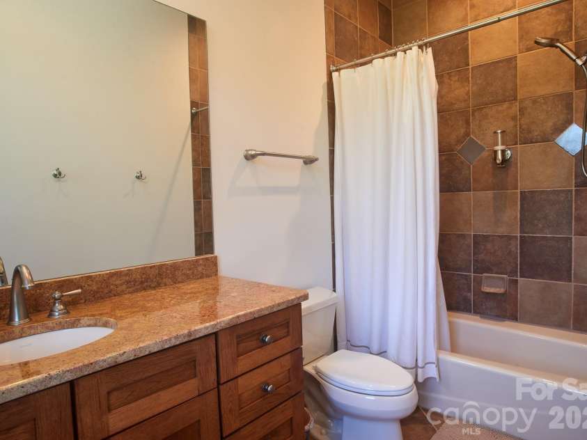427 Spring Rock Road, Burnsville, NC 28714.  MLS# CAR4379071, YatesRealty ID 27075. Basement - Fullbath