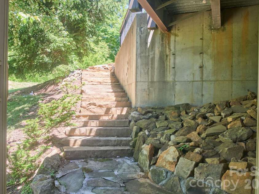 427 Spring Rock Road, Burnsville, NC 28714.  MLS# CAR4379071, YatesRealty ID 27075. Stone walkway added for additional Ingress/Egress into Workshop